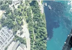  ?? AP FILE PHOTO ?? In this July 29 photo, black-coloured wastewater treatment discharge is released into the Niagara River below the falls in Niagara Falls, N.Y.