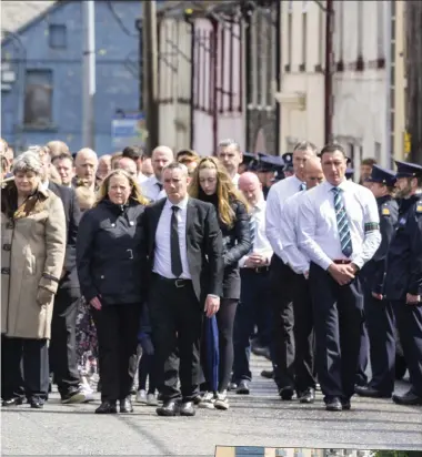  ?? Pics: Donal Hackett and Carl Brennan. ?? Gardaí carry the coffin of their slain colleague, Detective Garda Colm Horkan to St James’ Church, Charlestow­n for his funeral Mass on Sunday.