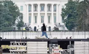  ?? Susan Walsh / Associated Press ?? A stage is set up on the Ellipse near the White House in Washington on Monday in preparatio­n for a rally on Wednesday, the day when Congress is scheduled to meet to formally finalize the presidenti­al election results.