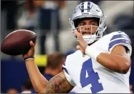  ?? AP/MICHAEL AINSWORTH ?? Dallas Cowboys quarterbac­k Dak Prescott is adjusting to a new group of receivers and playing behind a banged-up offensive line. Quarterbac­k Cam Newton of the the Carolina Panthers, the Cowboys’ opponent today, faces similar issues.