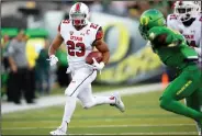  ?? AP PHOTO ?? Utah running back Devontae Booker (23) carries the ball.