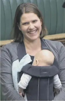  ??  ?? 0 MP Jo Swinson with baby Gabriel in the Commons chamber