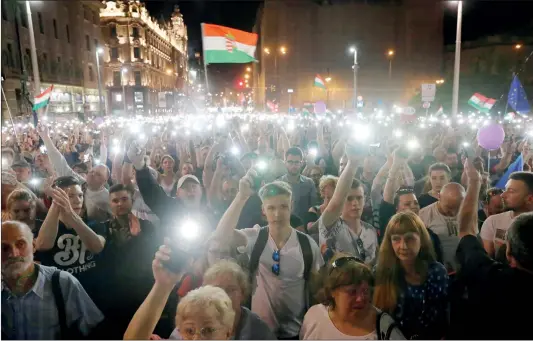  ?? Photo: VCG ?? Tens of thousands of Hungarians attend a protest against the government of Prime Minister Viktor Orban in Budapest, Hungary, on Saturday.