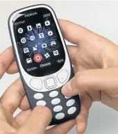  ?? Picture: VICTORIA JONES/PA IMAGES VIA GETTY IMAGES ?? DEBUT: The new Nokia 3310 mobile phone.