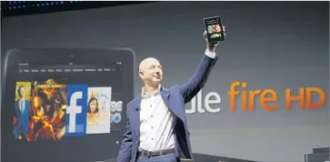  ?? Al Seib Los Angeles Times ?? AMAZON founder Jeff Bezos unveils the Kindle Fire HD in Santa Monica in 2012. The Seattle company gave the world a glimpse of its enormous ambition when it started making its own tech devices.