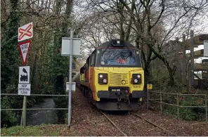  ??  ?? RIGHT: Moorswater
level crossing on November 25, 2020 with Colas Rail Class 70 70 810 propelling the final 6C36 0852 Aberthaw Tarmac to its destinatio­n.
(Bernard Mills)