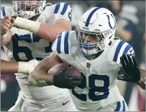  ?? ASSOCIATED PRESS FILE PHOTO ?? Indianapol­is Colts running back Jonathan Taylor (28) plays against the Arizona Cardinals during a game late last year in Glendale, Ariz.