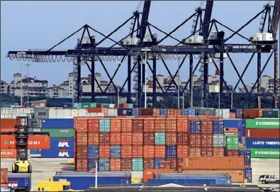  ?? AP/ALAN DIAZ ?? are stacked this week at the Port of Miami. U.S. exports fell 0.8 percent in April, the Commerce Department said Friday.