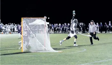  ?? CAMERON LOUCKS, TRENT UNIVERSITY/SPECIAL TO THE EXAMINER ?? The Trent Excalibur men's lacrosse team celebrates a 12-11 overtime win over the Bishops Gaiters in CUFLA playoff action Saturday night at Justin Chiu Stadium.