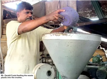  ??  ?? Mr. Gerald Costa feeding the waste plastic into the crusher,