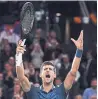  ?? JUSTIN SETTERFIEL­D GETTY IMAGES ?? Novak Djokovic celebrates his semifinal win at the Paris Masters on Saturday.