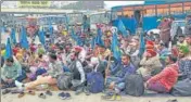  ?? SANJEEV KUMAR/HT ?? Protesting employees at the bus stand in Bathinda on Monday.