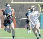  ?? JOHN LOVE / SENTINEL & ENTERPRISE ?? Salem State’s Madison White defends against Fitchburg State’s Nicole Kopacz during Saturday’s game.