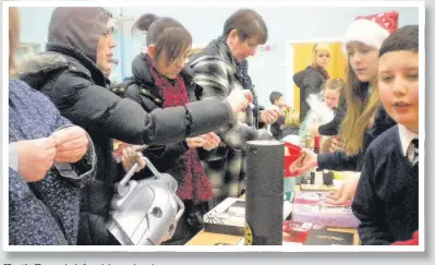  ??  ?? Hectic
The tombola for adults was kept busy