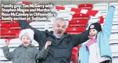  ??  ?? Family guy: Tim Mcgarry with Stephen Magee and Martha Rose Mccamley in Cliftonvil­le’s family section at Solitude