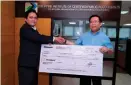  ?? CONTRIBUTE­D PHOTO ?? Philippine Institute of Certified Public Accountant­s (Picpa) National President Randy Blanza (left) hands over a check to Picpa Foundation Chairman Erwin Vincent Alcala.