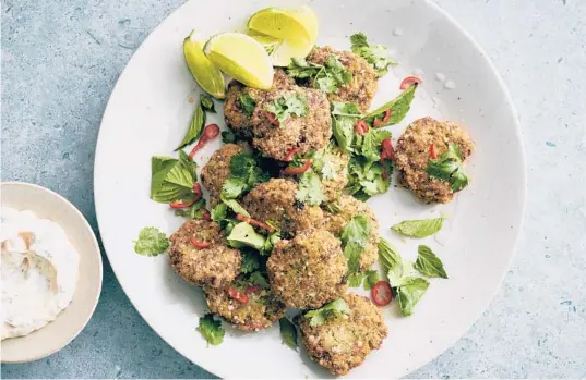  ?? DAVID MALOSH/THE NEW YORK TIMES PHOTOS ?? Crispy shrimp cakes with chile-lime mayo. For an untraditio­nal binder, crushed-up rice cakes are mixed in with the shrimp for a crisp result.