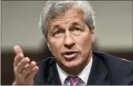  ?? THE ASSOCIATED PRESS ?? JPMorgan Chase CEO Jamie Dimon testifies before the Senate Banking Committee on Capitol Hill in Washington on June 13, 2012. During calls with reporters and Wall Street analysts on Friday, Dimon vented his irritation with politician­s and the news...