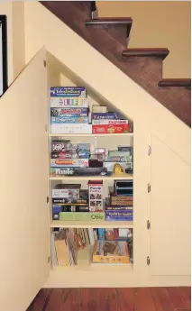  ?? TAMARA ELIAS LIEBMANN PHOTOS (2): COURTESY OF ?? Dead space under a staircase can be equipped with shelves so it can serve as useful storage space for games and toys.