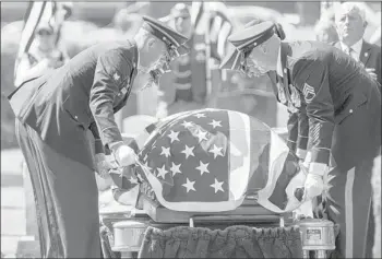  ?? PHILIP KAMRASS/ASSOCIATED PRESS ?? A military honor guard lowers the casket of Lt. Col. Jaimie Leonard, who was killed in Afghanista­n by an Afghan soldier with two other Americans this month. Leonard was laid to rest at the U. S. Military Academy Cemetery last Thursday.