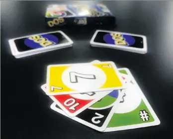  ?? THE ASSOCIATED PRESS ?? Mattel’s new card game Dos is part of a larger effort to update its classic brands.