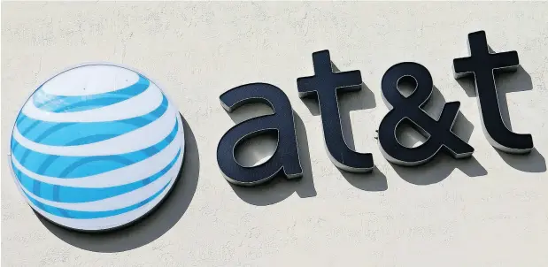  ?? ALAN DIAZ / THE ASSOCIATED PRESS FILES ?? The U.S. government estimates AT&T’s purchase of Time Warner Inc. would result in an increased cost of $580 million per year for industry rivals.