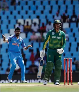  ?? Picture: AP PHOTO/THEMBA HADEBE ?? WHAT’S WRONG, QUINNY? Quinton De Kock reacts in pain after being hit by a Jasprit Bumrah delivery on Sunday.