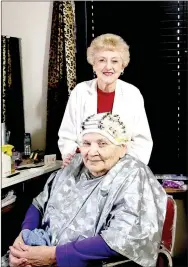  ?? LYNN KUTTER ENTERPRISE-LEADER ?? Ruth Dial of Prairie Grove gives a permanent to Louella Yates. Dial, 90, has been a hair stylist for about 60 years. She’s at Touch of Color now and has been working in Prairie Grove since 1974. Yates of Fayettevil­le has come to Dial for 40 years.