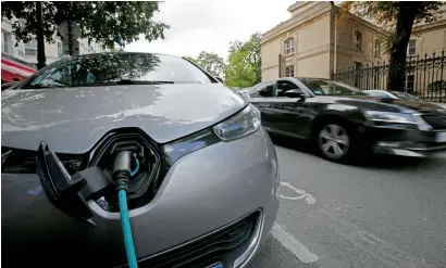  ?? Reuters ?? Tesla, Porsche and BMW are now making battery-powered cars with enough range to drive across countries. —