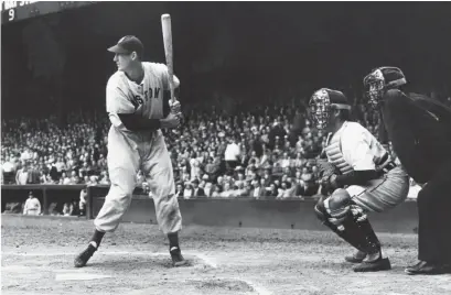  ?? SPORTING NEWS ARCHIVE/GETTY IMAGES ?? Boston Red Sox outfielder Ted Williams stands in the batter’s box. New footage of the slugger’s last game was recently discovered.