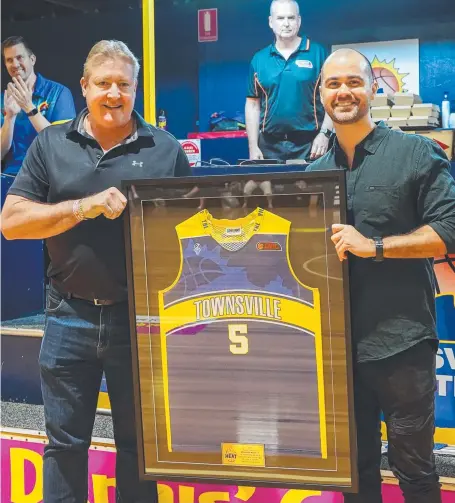  ??  ?? Steven Boyd presents Brendan Mccully with his retired Heat jersey. Picture: Supplied