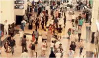  ?? Photos by Mohammad Mustafa Khan ?? Shoppers throng the Mall of the Emirates on Tuesday, the first day of the shopping festival. —