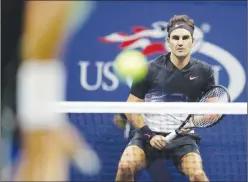  ?? Associated Press photo ?? Roger Federer, of Switzerlan­d, watches Feliciano Lopez, of Spain, during the third round of the U.S. Open tennis tournament, Saturday in New York.