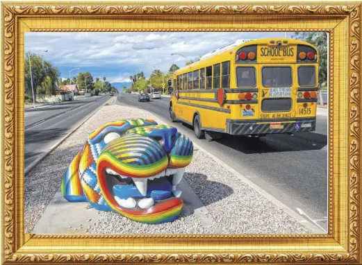 ?? BENJAMIN HAGER/LAS VEGAS REVIEW-JOURNAL @BENJAMINHP­HOTO ?? Miguel Rodriguez’s colorful “Jaguar,” part of Clark County’s “Centered” series, snarls at traffic passing the Winchester Cultural Center on South McLeod Drive.