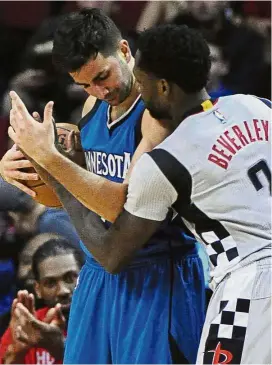  ??  ?? The ball is mine: Minnesota Timberwolv­es’ Ricky Rubio (left) and Houston Rockets’ Patrick Beverley having a heated exchange. — AP