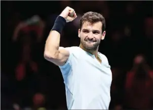  ?? GLYN KIRK/AFP ?? Bulgaria’s Grigor Dimitrov celebrates his three set victory over US player Jack Sock in their men’s singles semifinal match on day seven of the ATP World Tour Finals tennis tournament at the O2 Arena in London on Saturday.