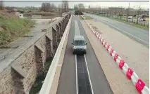  ?? QUALCOMM ?? A Renault Kangoo Z.E. electric car testing an inductive charging road near Paris. Could such roads be the future of electric vehicles?