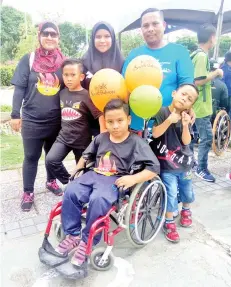  ??  ?? Amirhad participat­ed in the Walk-Wheelathon 2017 with his wife and four children at Likas Bay here yesterday.