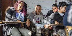  ?? MARVIN JOSEPH / WASHINGTON POST ?? RuQuan Brown (center) enjoys hearing what his Banneker classmates think, and he believes in the importance of ensuring they all get the same great opportunit­ies.