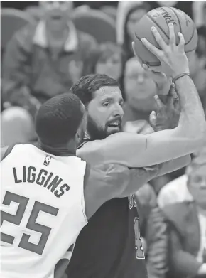  ??  ?? Bucks guard DeAndre Liggins pressures Bulls forward Nikola Mirotic during the first half Tuesday night at the BMO Harris Bradley Center. Mirotic led the Bulls with 24 points.