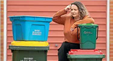  ?? SIMON O’CONNOR/ STUFF ?? Not everyone is confident about how to effectivel­y use New Plymouth’s new bin system.