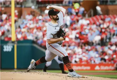  ?? Scott Kane / Getty Images ?? Giants left-hander Carlos Rodón gave up eight runs on 10 hits in 32⁄3 innings against the Cardinals on Sunday.