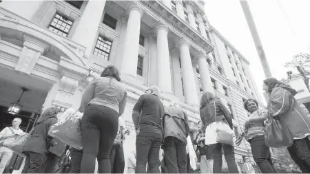  ??  ?? Disgruntle­d Sears employees gather outside Ontario Superior Court in Toronto on Thursday.