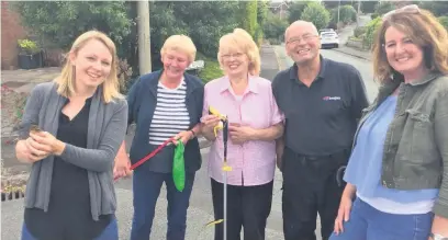  ??  ?? Residents on Birchway, Bollington, who rescued a duckling stuck in a drain