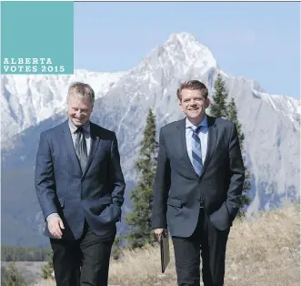  ?? GAVIN YOUNG/ CALGARY HERALD ?? Wildrose Leader Brian Jean walks with Banff- Cochrane Wildrose candidate Scott Wagner at the Kananaskis Golf Course on Wednesday.