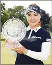 ??  ?? So Yeon Ryu of South Korea poses with the winner’s trophy after winning the Meijer LPGA Classic for Simply Give at Blythefiel­d Country Club on June 17 in Grand Rapids,
Michigan. (AFP)