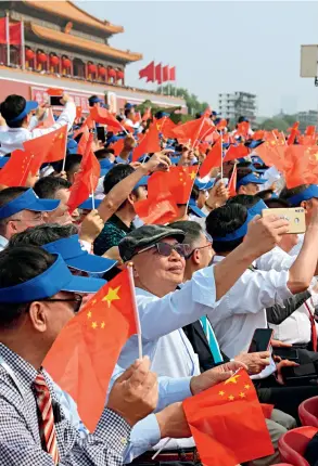  ??  ?? On October 1, 2019, the grand ceremony celebratin­g the 70th anniversar­y of the founding of the People’s Republic of China is held in Beijing. Around 2,000 overseas Chinese are invited to witness the historic moment.