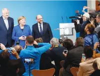  ?? (Hannibal Hanschke/Reuters) ?? ACTING GERMAN CHANCELLOR Angela Merkel, CSU leader Horst Seehofer and SPD leader Martin Schulz attend a news conference in Berlin last week.