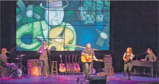  ?? JANESSA HOGAN/SUBMITTED PHOTO ?? Cast members of “Searching For Abegweit: The Island Songs & Stories of Lennie Gallant” perform in Wolfville. From left are Lawrence Gallant, Sean Kemp, violin, Lennie Gallant, lead vocals/ guitar, Patricia Richard, multi-instrument­alist/vocals, and...