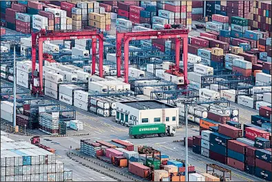  ?? AP ?? The expansive Yangshan port in Shanghai is pictured in March. China’s exports fell 2.7 percent in March from a year earlier to $174.1 billion, and its previous global trade surplus swung to a $5 billion deficit.